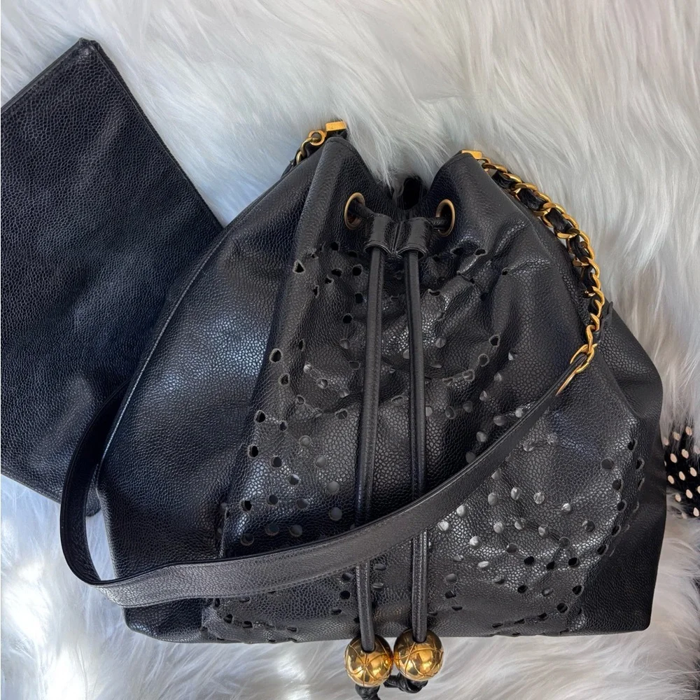 Authentic CHANEL perforated bucket black leather with pouch